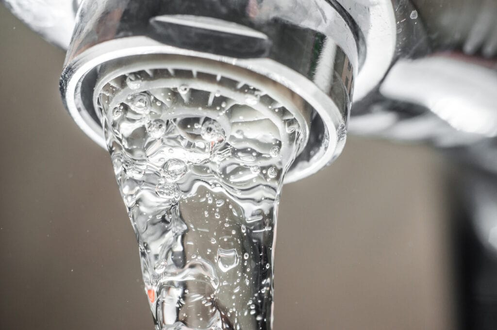 water flowing from water softening unit
