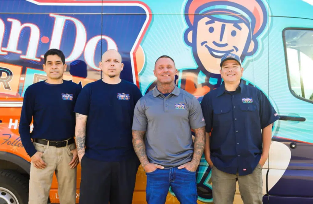 employees in front of van