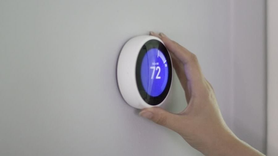 Smart thermostat installed into the wall.